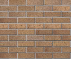 a brown brick wall that is made out of bricks