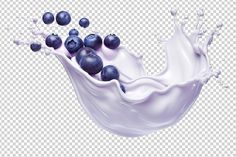 blueberries are falling into a milk splash