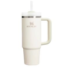 the white travel mug has a stainless steel lid and is holding a straw in it