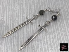 Excited to share this item from my #etsy shop: Sword Earrings, Game Of Thrones, Jon Snow's Sword, Silver Sword Earrings with Obsidian, Long Sword Earrings, Gothic Earrings, Gothic Jewelry Berserk Aesthetic, Knife Earrings, Rose Thorns, Dagger Earrings, Earrings Gothic, Gothic Earrings, Gothic Jewelry, Jon Snow, Costume Jewelry