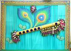 an artisticly decorated instrument with peacocks and flowers on the front, against a blue background