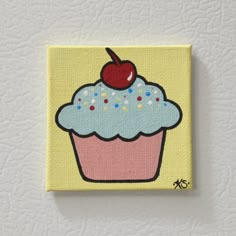 a painting of a cupcake with sprinkles and a cherry on top