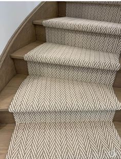 some stairs with carpet on them in a house