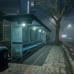 an empty bus stop on a foggy night