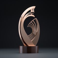 an award is displayed on a black surface with a wooden base and a circular shape