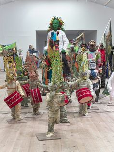 a group of people standing around each other in costume