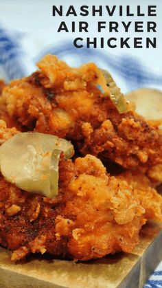 the cover of nashville air fryer chicken on a wooden cutting board with blue and white checkered cloth