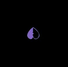 a purple drop in the middle of a black background