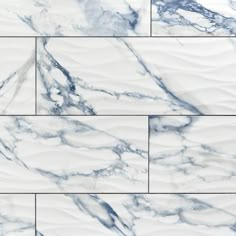 white and blue marble tile with wavy lines in the center, on top of each other