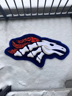 an image of a snow covered building with a logo on it