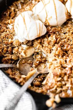 a skillet filled with some kind of dessert and ice cream on top of it