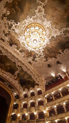 an ornately decorated ceiling in a theatre