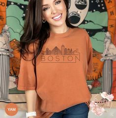 "Boston Skyline Shirt, Comfort Colors Shirt, City Skyline Shirts, City Shirt, Custom Name City Shirt, Comfort Colors Tee, Gift For Her Materials & Features: *6.1 oz., 100% ring spun cotton *Preshrunk, soft-washed, garment-dyed fabric *Twill taped shoulder-to-shoulder *Set-in sleeves *Double-needle stitched sleeves and bottom hem *1\" ribbed collar with double-needle topstitched neckline Washing: Wash with cold/warm water Drying: Tumble dry on low heat or hang dry PLEASE NOTE: All our apparel is Skyline Shirt, Boston Skyline, Cat Mom Shirts, Cat Lover Shirt, Cat Mom Gifts, Chicago Skyline, Comfort Colors Shirt, Comfort Colors Tee, Dyed Fabric