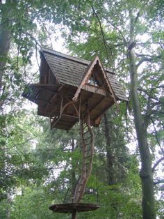 a tree house in the middle of some trees