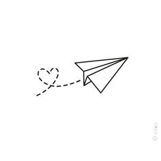 a paper airplane flying in the sky with a heart drawn on it's tail