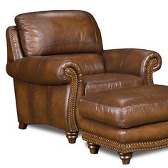 a brown leather chair and footstool with nail polishing on the armrests