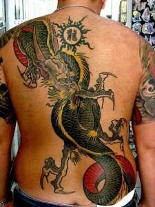 a man with a dragon tattoo on his back