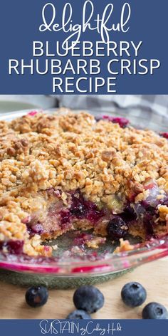 a blueberry rhubarb crumble pie on a table with fresh blueberries