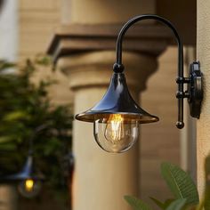 an outdoor light on the side of a building