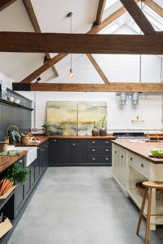 a large kitchen with an island in the middle and lots of counter space on one side