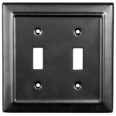 two toggles are shown on the wall in this black metal switchplate cover