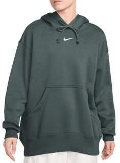 Grounded in style, comfort and versatility, meet Nike's take on luxury loungewear. This classic hoodie helps you stay cozy all day long, thanks to midweight fleece that feels soft yet structured. Plus, exaggerated details (like taller ribbing and oversized fit) give you a trend-right look. Fit & Design: Oversized fit: exaggerated and spacious Fits large; we recommend ordering a size down Midweight brushed fleece feels extra soft on the inside and smooth on the outside, helping you stay cozy while keeping its structured shape Dropped shoulders and roomy sleeves provide a relaxed, oversized feel Drawcord hood Elongated ribbing Oversized pocket Embroidered Swoosh logo Nike Sportswear Phoenix Fleece, Sporty Hoodie, Black Dress Trousers, Luxury Loungewear, Women's Sportswear, Loungewear Luxury, Mens Formal, Swoosh Logo, Oversized Pullover