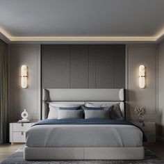 a large bed sitting in the middle of a bedroom next to two wall sconces