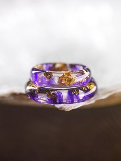 Introducing our Purple Resin Ring--a wearable masterpiece handcrafted for everyday elegance and personal style. This unique Artisan Ring, made with care and creativity, stands out with its captivating shade of purple.  At Foxy Studio, we take pride in offering Handmade Jewelry that reflects individuality. Each Resin Ring is a one-of-a-kind creation. Explore our Etsy Jewelry collection for affordable Gift Ideas for Her, all under $50, and make a statement with enduring pieces that last. Embrace t Handmade Toe Ring Jewelry Gift, Handmade Toe Ring Jewelry For Gifts, Handmade Gold Stackable Promise Rings, Gold Handmade Stackable Promise Rings, Minimalist Handmade Promise Jewelry, Minimalist Bangle Rings For Gifts, Handmade Adjustable Stackable Rings As Gift, Unique Handmade Stackable Rings For Gift, Unique Handmade Stackable Rings As Gift