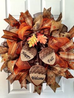 a welcome fall wreath hanging on the front door