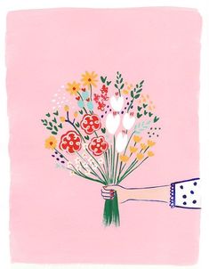 a hand holding a bouquet of flowers on a pink background with white polka dot dots