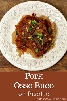 pork osso buco on risotto with garlic and parsley in brown sauce