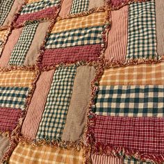 an old patchwork quilt with many different colors