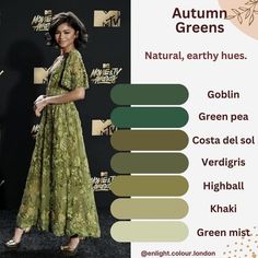 a woman in a green dress standing next to a black wall with the words autumn greens on it