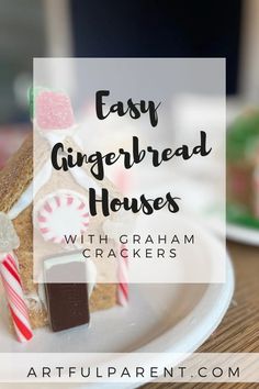 a gingerbread house with graham crackers and candy canes on it is featured in the article easy gingerbread houses