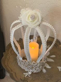 White metal crown corona with pearls and flowers.  Candle not included Pearls And Flowers, Bling Candles, White Candle Sticks, Mckenzie And Childs, Metal Crown, Tissue Box Holder, Tampa Fl, Tiaras And Crowns, Candlestick Holders