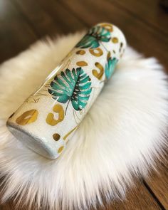 a close up of a lighter on a fur rug