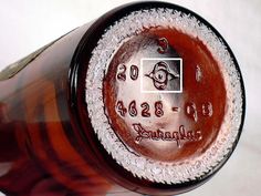 a close up view of a brown bottle with writing on the top and bottom half