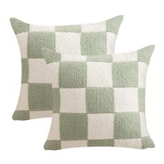 two green and white checkered pillows on a white background, one has a square pattern