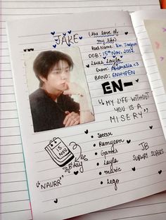 a notepad with an image of a young man's face and handwritten notes on it