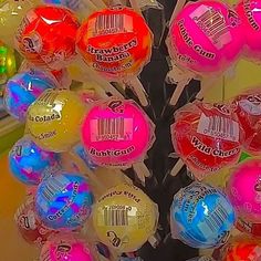 there are many lollipops on display in the store