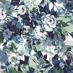 a blue and white floral wallpaper with green leaves