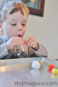 a little boy that is eating some kind of candy