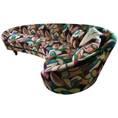 a curved couch with colorful designs on it