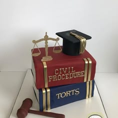 a cake made to look like a book with a judge's gavel on top