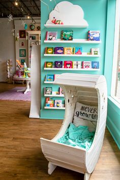 a child's room with bookshelves and toys