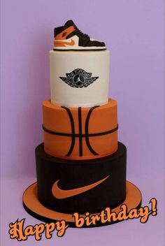 a birthday cake made to look like a basketball shoe on top of a basket ball