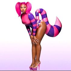 a woman in pink and purple striped catsuits posing for the camera with her legs spread out