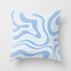 a blue and white pillow with wavy lines on it