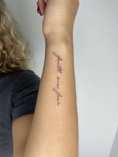 a woman with a tattoo on her arm