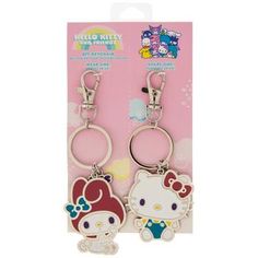 two hello kitty key chains are in the packaging